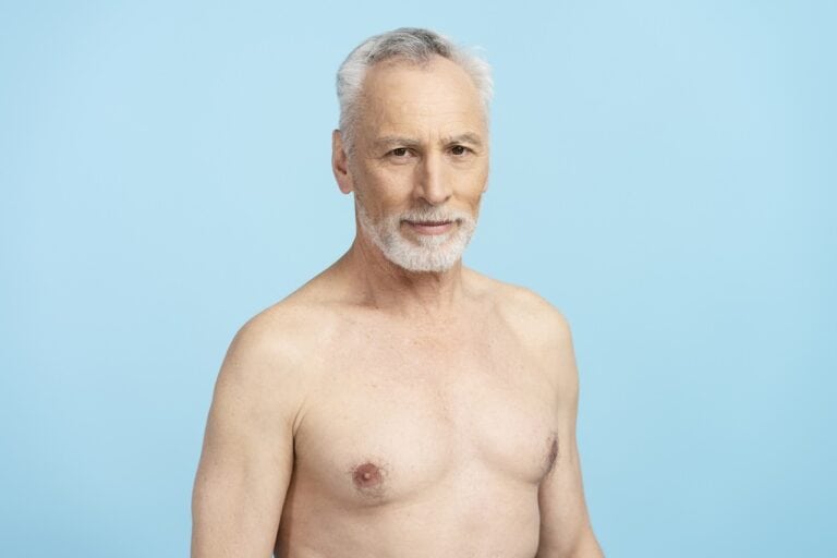 senior man with suffering from chest growth