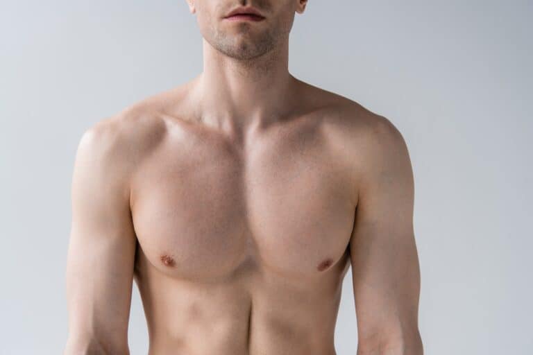 close up on shirtless man's chest