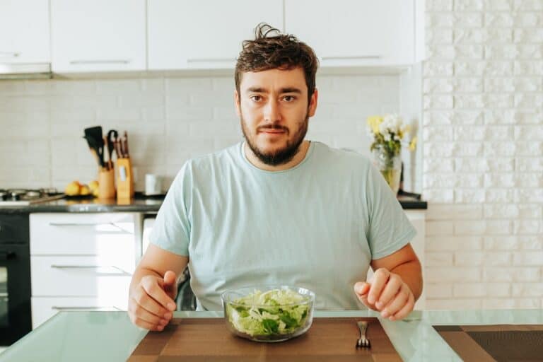 man eating salad